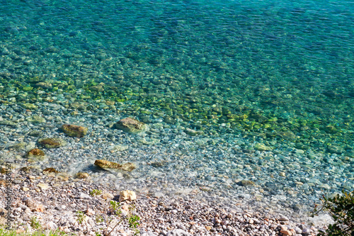Idyllic crystal clear turquoise waters with pebbles
