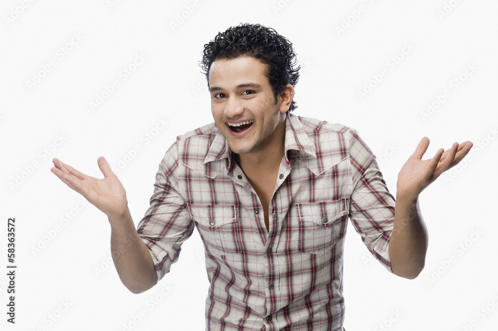 Portrait of a man shrugging and smiling Portrait of a man shrugging and smiling