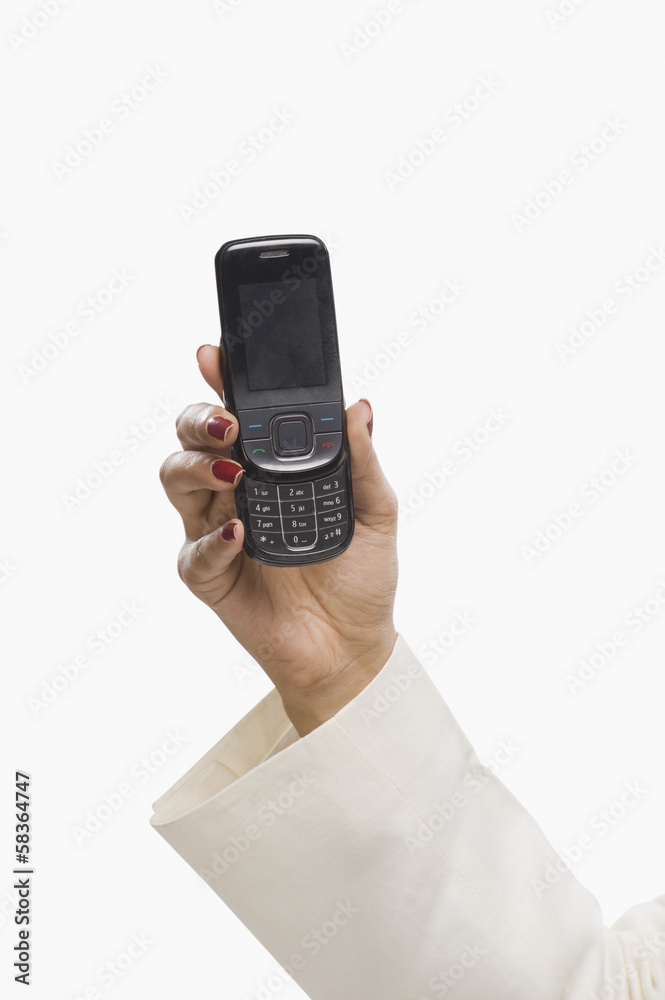 Close-up of a businesswoman's hand showing a mobile phone Close-up of a businesswoman's hand showing a mobile phone