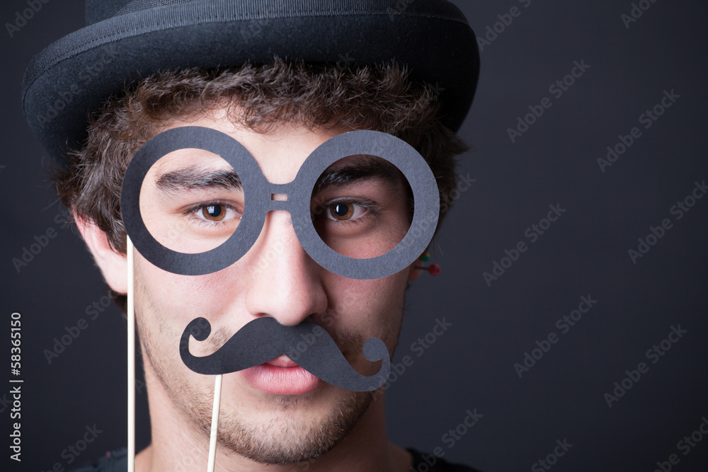 Boy with mustache looking at camera Boy with mustache looking at camera