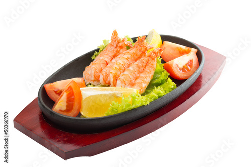 fried shrimp with vegetables on plate isolated