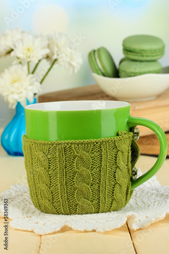 Cup with knitted thing on it close up