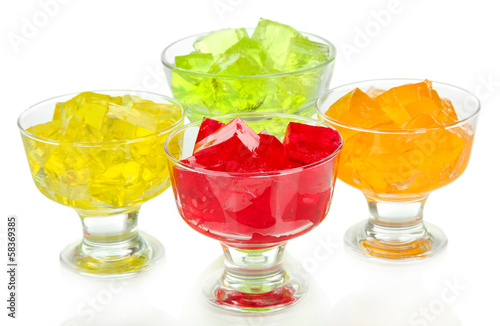 Tasty jelly cubes in bowls isolated on white photo