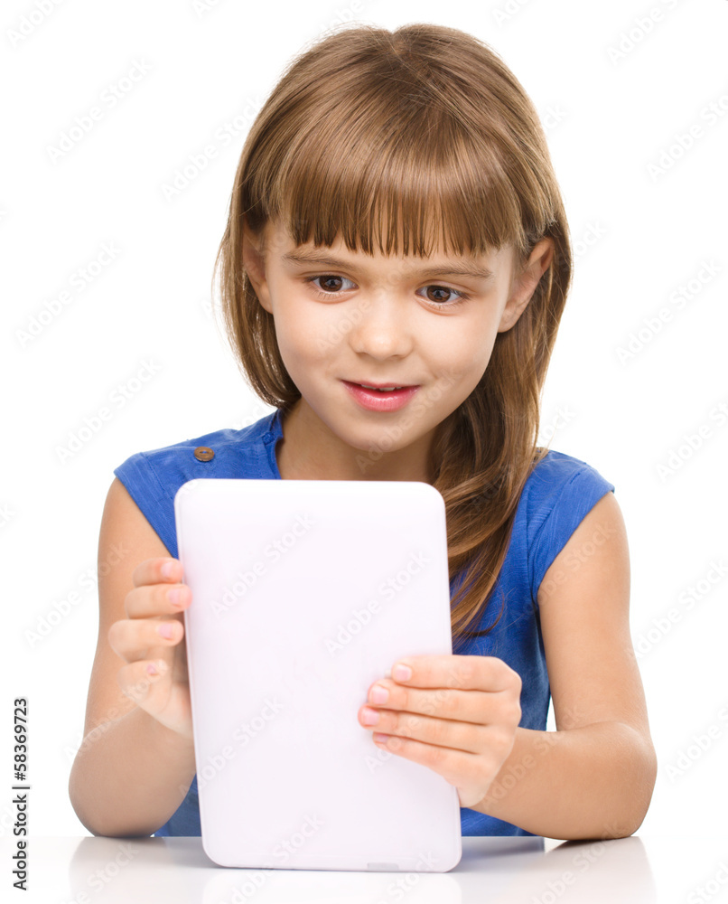 Young cheerful girl is using tablet Young cheerful girl is using tablet