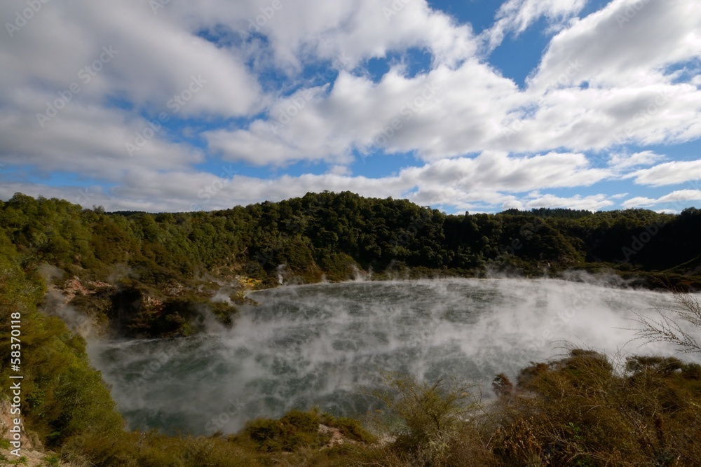 Steaming geo-thermal crater and lake in Waimangu Thermal Park Steaming geo-thermal crater and lake in Waimangu Thermal Park