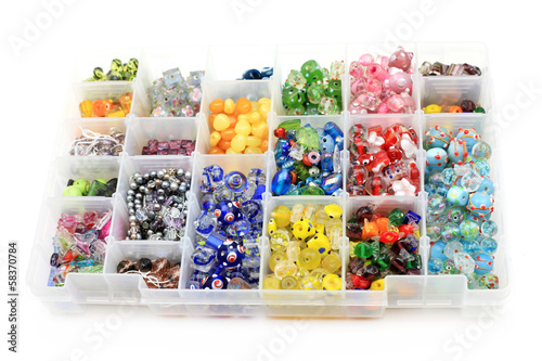 Fototapeta Box of colorful glass beads