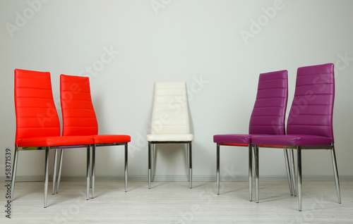 Modern  color chairs on wall background