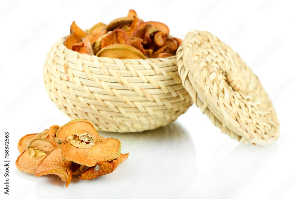 Dried apples in wicker basket, isolated on white Dried apples in wicker basket, isolated on white