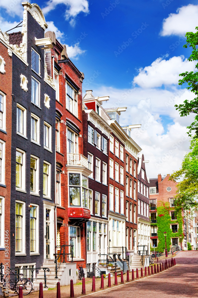 Amsterdam and typical houses with clear summer sky.Netherlands