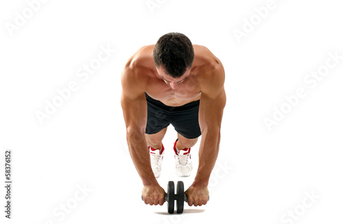 Bodybuilder working on his abs with a ab roller.