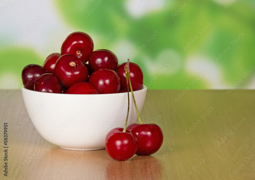 Close-up sweet cherries in ceramic cup Close-up sweet cherries in ceramic cup