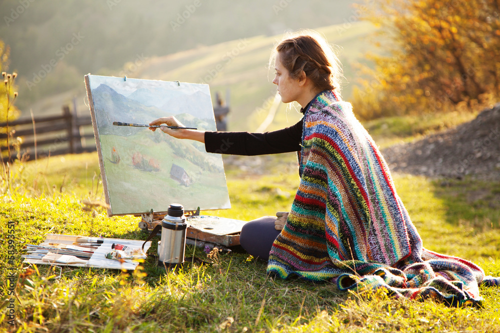 Young artist painting an autumn landscape - obrazy, fototapety, plakaty 