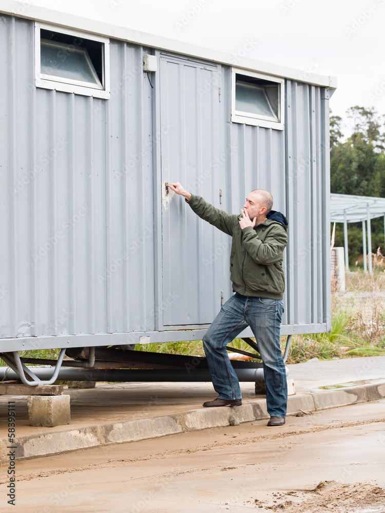 Man opening a hut site Man opening a hut site