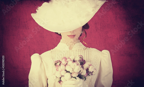 Beautiful redhead women with bouquet