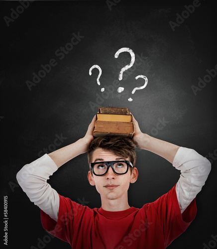 Emotional screaming pupil boy near chalkboard