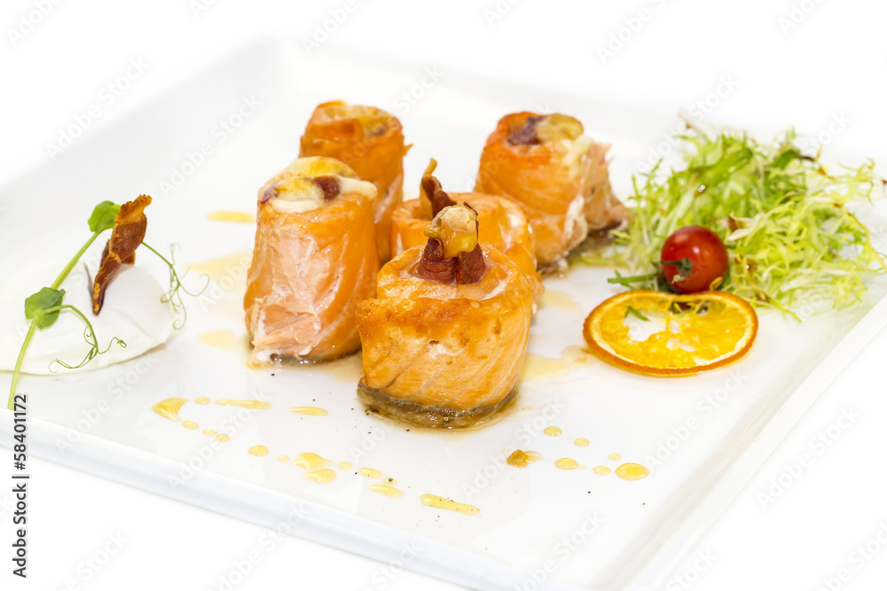 baked salmon rolls on a table in a restaurant baked salmon rolls on a table in a restaurant