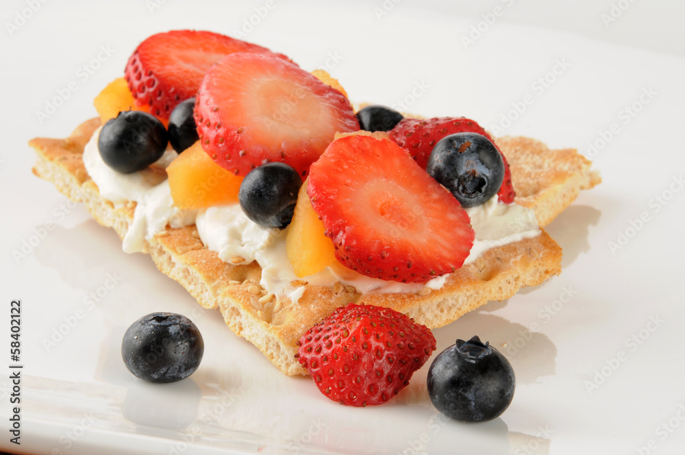 Fruit and cream cheese on sesame flatbread Fruit and cream cheese on sesame flatbread