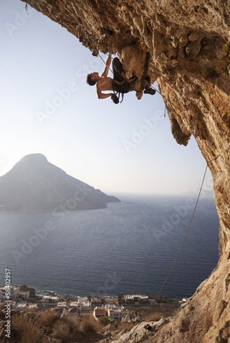 Rock climber at sunset, Kalymnos Island, Greece
