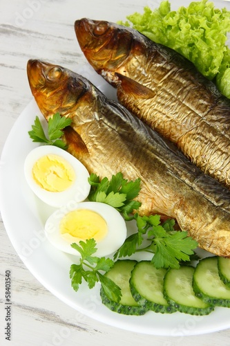 Smoked fish on plate close up