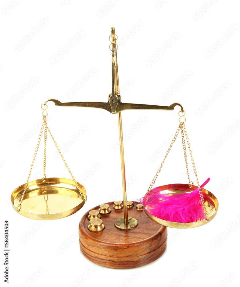 Balance scale with feather isolated on white