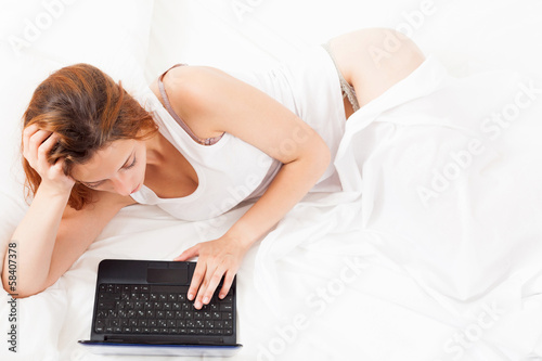  pretty  woman awaking with laptop