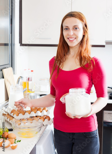 Woman making dough with flour