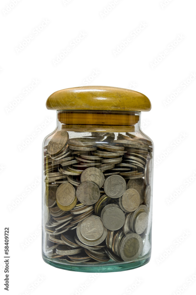 Glass bottle full of coins on white.(This image contain clipping Glass bottle full of coins on white.(This image contain clipping