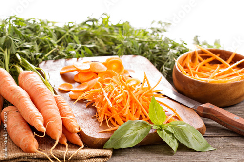 Fresh carrot, whole, sliced and grated