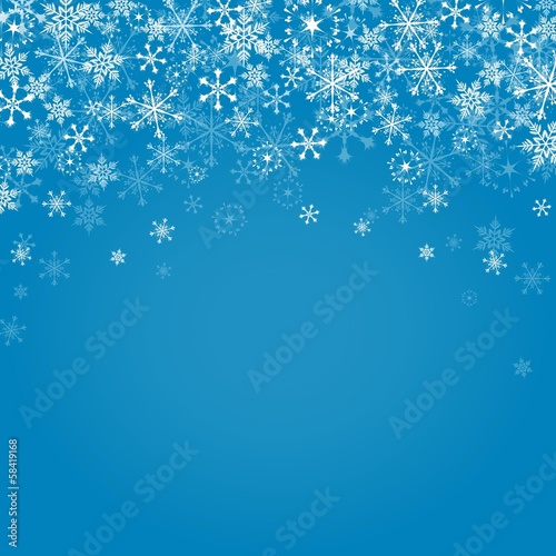 Falling snowflakes on blue background