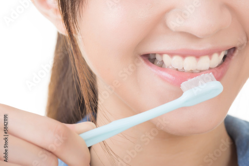 Closeup shot of woman brushing teeth