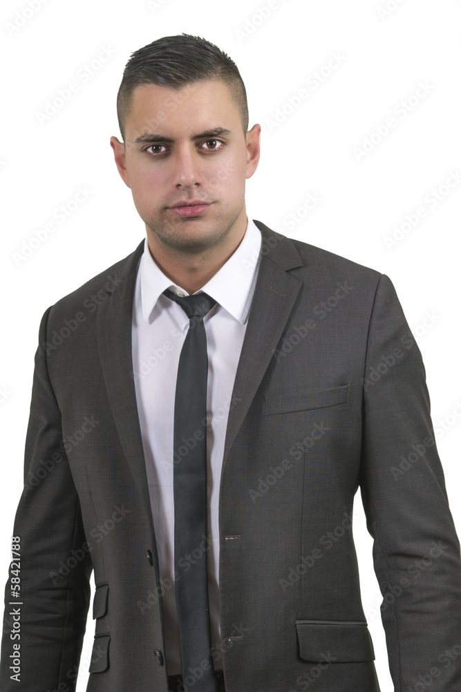 Serious looking young businessman in a suit (white background) Serious looking young businessman in a suit (white background)