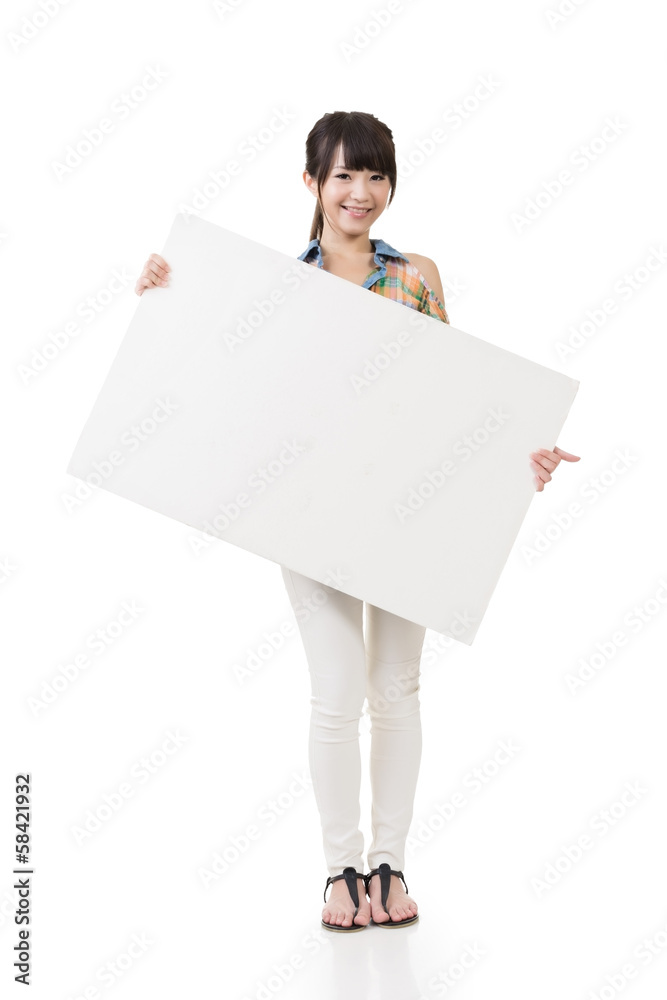 Attractive young asian woman holding blank board Attractive young asian woman holding blank board