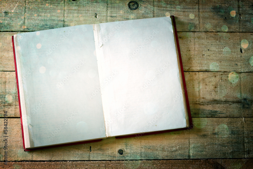 Obraz premium open book with golden glitter lights