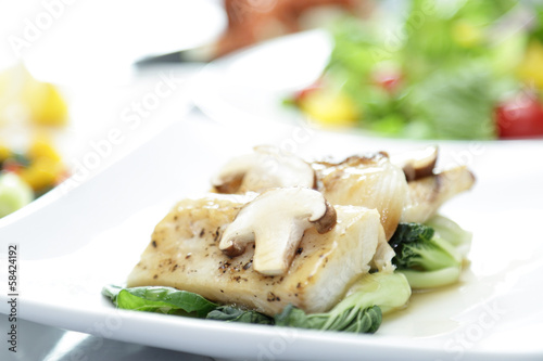 Fish meat with champignon mushroom