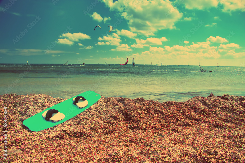 Board for windsurfing on the seashore, with a retro effect Board for windsurfing on the seashore, with a retro effect