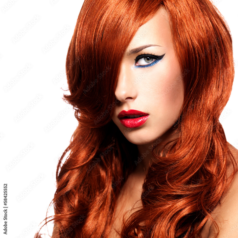 Fototapeta premium Portrait of a woman with long red hairs