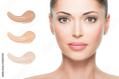 Model face of beautiful woman with foundation on skin photo