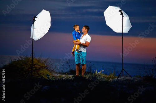 behind the scene, shooting outdoor portraits with flash lights photo