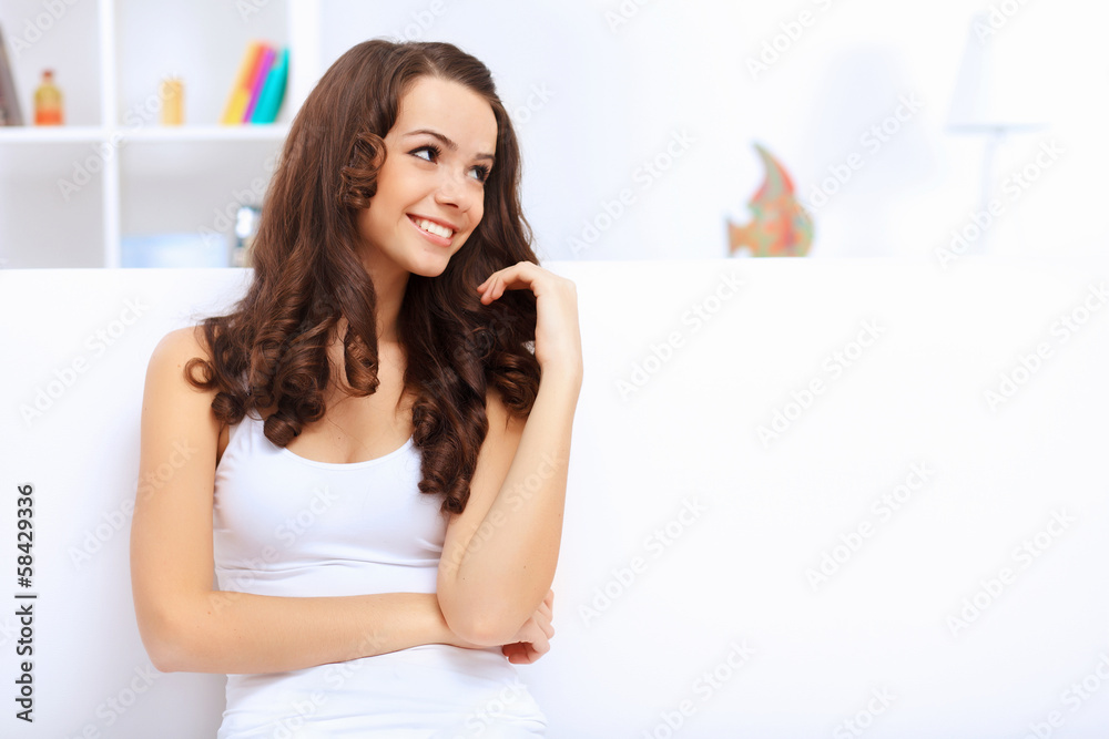 Young pretty woman in white at home Young pretty woman in white at home