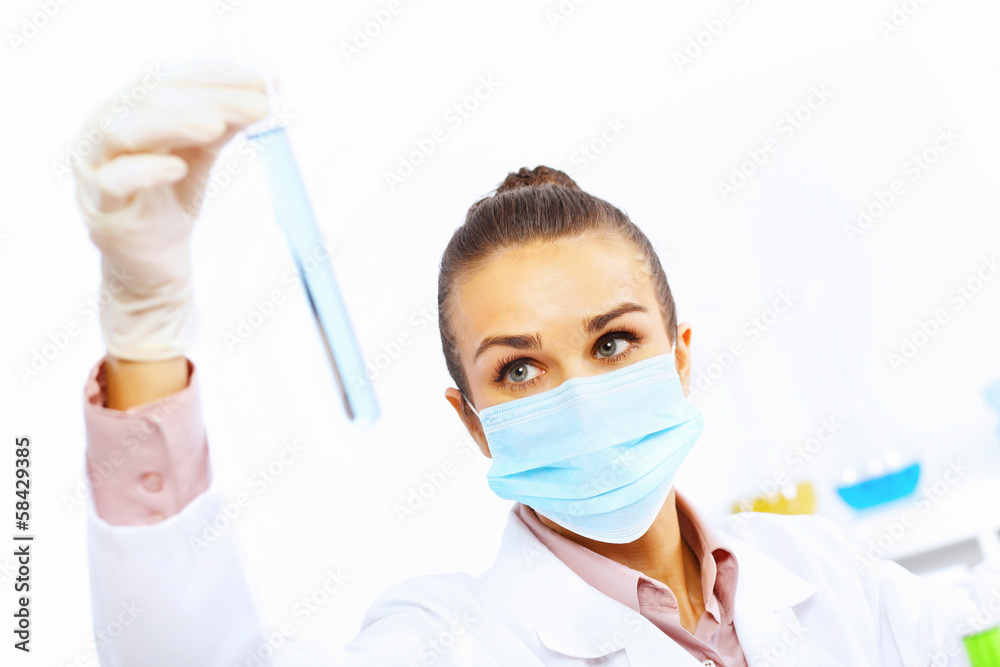 Young female scientist working in laboratory Young female scientist working in laboratory