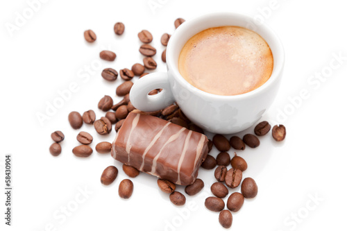 Small espresso cup with chocolate and coffee beans isolated on w