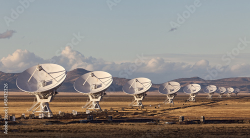 Very Large Array satellite dishes at Sunset in New Mexico, USA photo