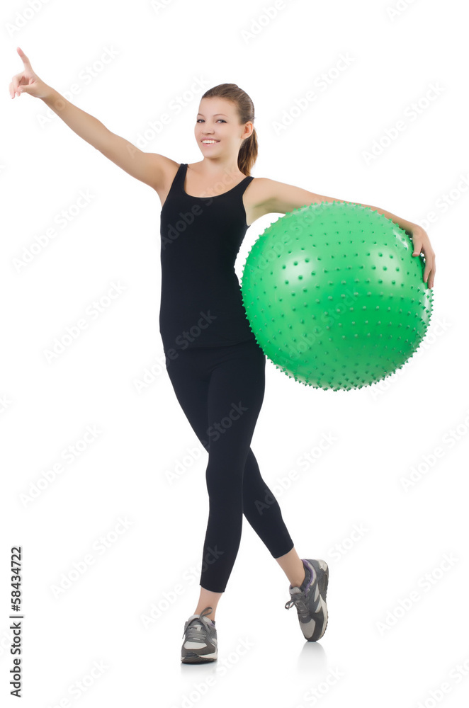 Young woman with ball exercising on whitee