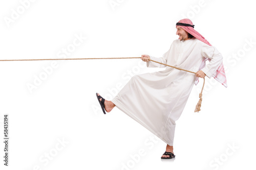 Arab in tug of war concept on white