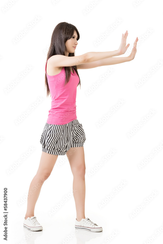 Woman pushing or leaning on wall Woman pushing or leaning on wall