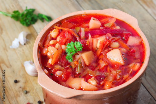 Russian borscht on rustic table photo