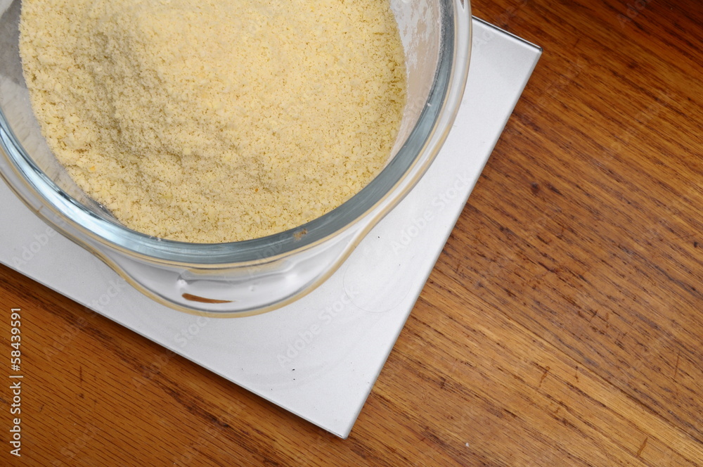 Almonds powder in glass bowl Almonds powder in glass bowl