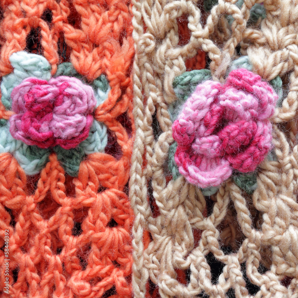 handmade woolen scarfs decorated with with flowers as background handmade woolen scarfs decorated with with flowers as background