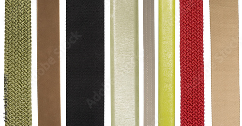 Closeup of various leather and fabric belts