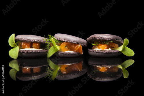 Fototapeta Naklejka Na Ścianę i Meble -  Macaroons filled with salmon and greenery